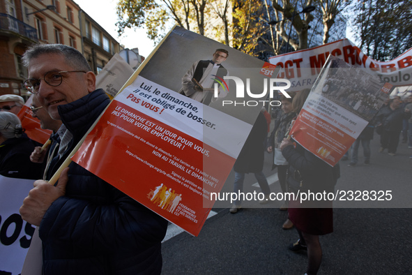 Protesters hold posters depicting a priest and reading 'him, he's compelling to work on sundays. You, you are not !'. More than 4000 protest...