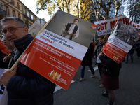 Protesters hold posters depicting a priest and reading 'him, he's compelling to work on sundays. You, you are not !'. More than 4000 protest...