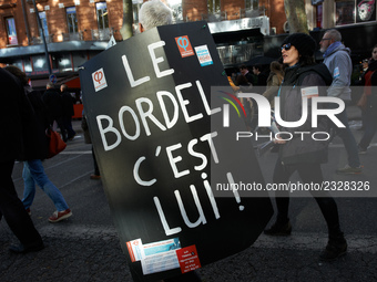 A man walks with a placard reading 'The mess, it's him !' in a reference to French President Macron. More than 4000 protesters took to the s...