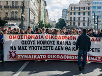 Protesters from the communist labour union PAME take part in a demonstration against changes to laws about calling strikes in Athens, Greece...