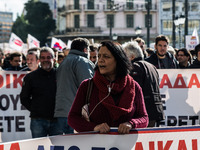 Protesters from the communist labour union PAME take part in a demonstration against changes to laws about calling strikes in Athens, Greece...