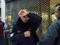 An injured riot police officer after the communist labour union PAME storming the Labour Ministry during a demonstration against changes to...