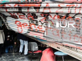 The damaged entrance of the Labour Ministry is seen, after protesters from the Greek Communist labour union stormed in during a demonstratio...