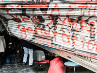 The damaged entrance of the Labour Ministry is seen, after protesters from the Greek Communist labour union stormed in during a demonstratio...