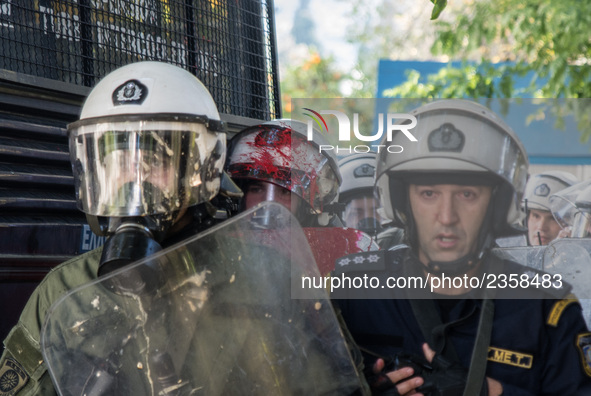 A riot police covered with paint after the attack from the communist labour union PAME outside the Maximou in Athens, Greece on December 5,...