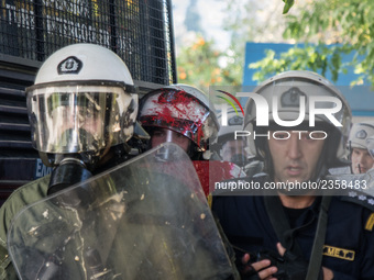 A riot police covered with paint after the attack from the communist labour union PAME outside the Maximou in Athens, Greece on December 5,...