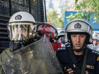 A riot police covered with paint after the attack from the communist labour union PAME outside the Maximou in Athens, Greece on December 5,...