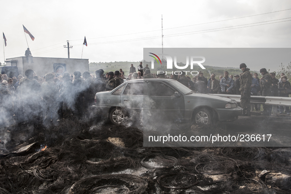 Pro-Russian civilians protesting against the advance of the Ukrainian army, after violent clashes the previous night. In the background Kara...