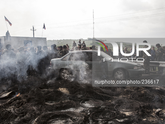 Pro-Russian civilians protesting against the advance of the Ukrainian army, after violent clashes the previous night. In the background Kara...