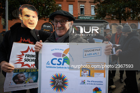 A protester of the CSL (Confederation Sociale des Familles)  shows a placard for the personnal housing allowance. As Macron's government red...