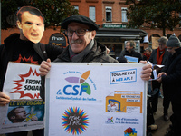 A protester of the CSL (Confederation Sociale des Familles)  shows a placard for the personnal housing allowance. As Macron's government red...