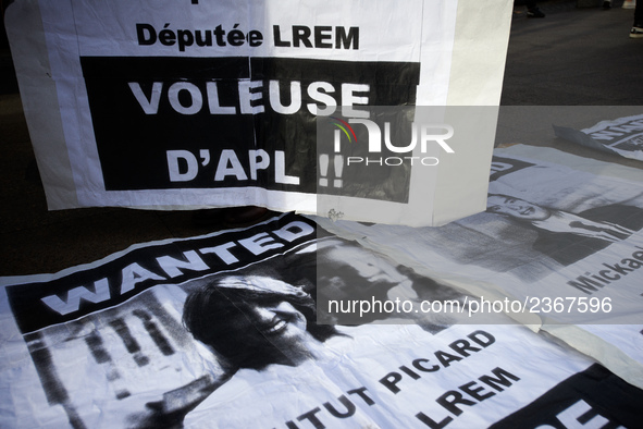 Posters depicting deputies of LREM (Macron's party) and reading 'Thieves of Personnal Housing allowance'. As Macron's government reduce pers...