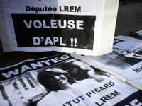 Posters depicting deputies of LREM (Macron's party) and reading 'Thieves of Personnal Housing allowance'. As Macron's government reduce pers...