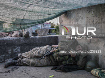 Pro-Russian militant sleeping after a night of intense fighting (