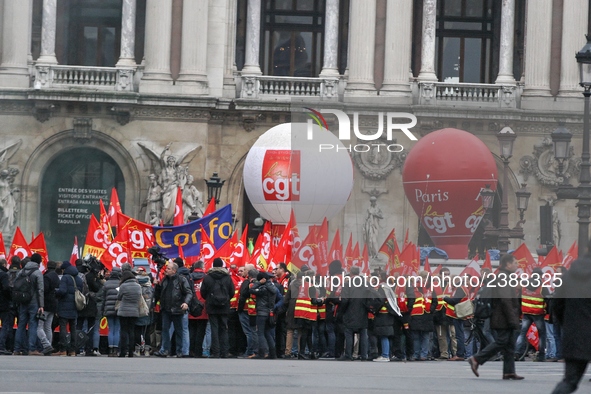 French General Confederation of Labour (CGT) unionists gather in front of Paris' Opera Garnier on December 20, 2017, to protest against Fren...