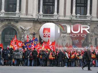 French General Confederation of Labour (CGT) unionists gather in front of Paris' Opera Garnier on December 20, 2017, to protest against Fren...