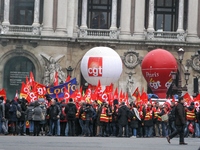 French General Confederation of Labour (CGT) unionists gather in front of Paris' Opera Garnier on December 20, 2017, to protest against Fren...