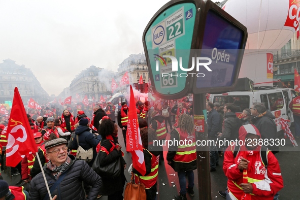 French General Confederation of Labour (CGT) unionists gather in front of Paris' Opera Garnier on December 20, 2017, to protest against Fren...