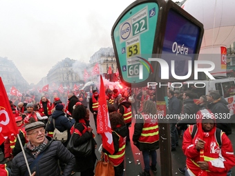 French General Confederation of Labour (CGT) unionists gather in front of Paris' Opera Garnier on December 20, 2017, to protest against Fren...