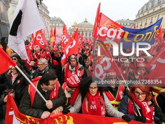 French General Confederation of Labour (CGT) unionists gather in front of Paris' Opera Garnier on December 20, 2017, to protest against Fren...