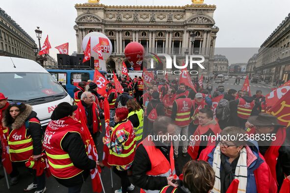 French General Confederation of Labour (CGT) unionists gather in front of Paris' Opera Garnier on December 20, 2017, to protest against Fren...