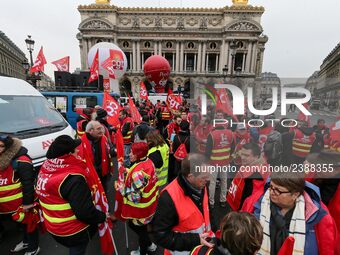 French General Confederation of Labour (CGT) unionists gather in front of Paris' Opera Garnier on December 20, 2017, to protest against Fren...