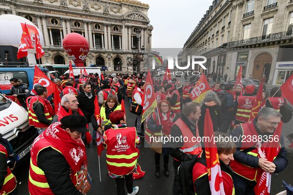 French General Confederation of Labour (CGT) unionists gather in front of Paris' Opera Garnier on December 20, 2017, to protest against Fren...