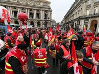 French General Confederation of Labour (CGT) unionists gather in front of Paris' Opera Garnier on December 20, 2017, to protest against Fren...