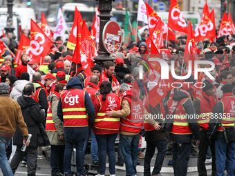 French General Confederation of Labour (CGT) unionists gather in front of Paris' Opera Garnier on December 20, 2017, to protest against Fren...