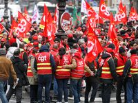 French General Confederation of Labour (CGT) unionists gather in front of Paris' Opera Garnier on December 20, 2017, to protest against Fren...