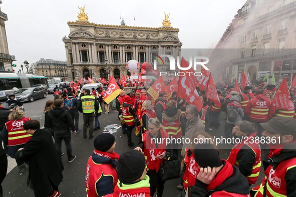 French General Confederation of Labour (CGT) unionists gather in front of Paris' Opera Garnier on December 20, 2017, to protest against Fren...