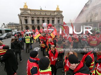 French General Confederation of Labour (CGT) unionists gather in front of Paris' Opera Garnier on December 20, 2017, to protest against Fren...