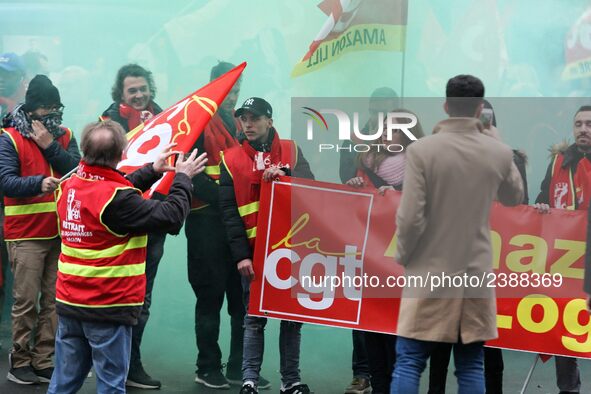 French General Confederation of Labour (CGT) unionists gather in front of Paris' Opera Garnier on December 20, 2017, to protest against Fren...