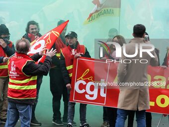 French General Confederation of Labour (CGT) unionists gather in front of Paris' Opera Garnier on December 20, 2017, to protest against Fren...