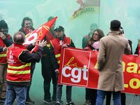 French General Confederation of Labour (CGT) unionists gather in front of Paris' Opera Garnier on December 20, 2017, to protest against Fren...