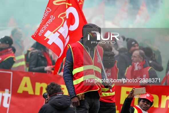 French General Confederation of Labour (CGT) unionists gather in front of Paris' Opera Garnier on December 20, 2017, to protest against Fren...