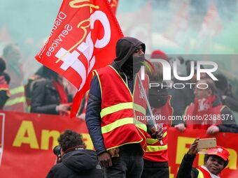 French General Confederation of Labour (CGT) unionists gather in front of Paris' Opera Garnier on December 20, 2017, to protest against Fren...