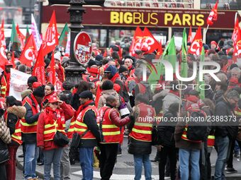 French General Confederation of Labour (CGT) unionists gather in front of Paris' Opera Garnier on December 20, 2017, to protest against Fren...