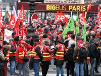 French General Confederation of Labour (CGT) unionists gather in front of Paris' Opera Garnier on December 20, 2017, to protest against Fren...