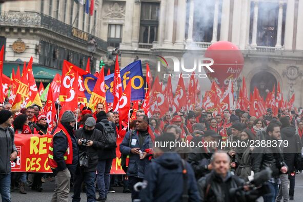 French General Confederation of Labour (CGT) unionists gather in front of Paris' Opera Garnier on December 20, 2017, to protest against Fren...