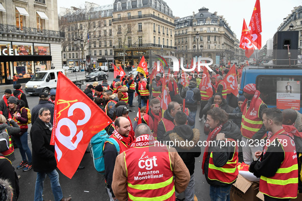 French General Confederation of Labour (CGT) unionists gather in front of Paris' Opera Garnier on December 20, 2017, to protest against Fren...