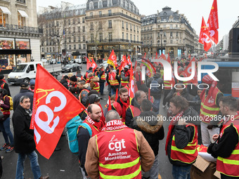 French General Confederation of Labour (CGT) unionists gather in front of Paris' Opera Garnier on December 20, 2017, to protest against Fren...