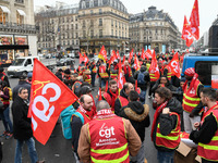 French General Confederation of Labour (CGT) unionists gather in front of Paris' Opera Garnier on December 20, 2017, to protest against Fren...