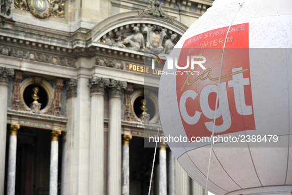 French General Confederation of Labour (CGT) unionists gather in front of Paris' Opera Garnier on December 20, 2017, to protest against Fren...