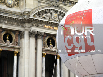 French General Confederation of Labour (CGT) unionists gather in front of Paris' Opera Garnier on December 20, 2017, to protest against Fren...