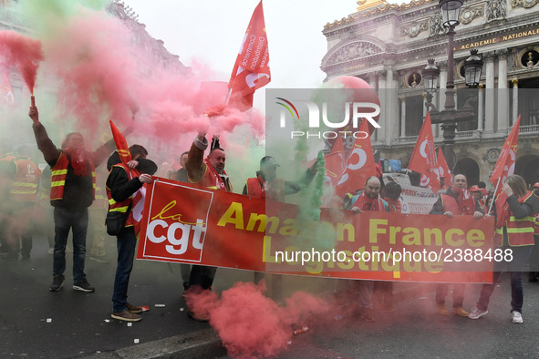 French General Confederation of Labour (CGT) unionists gather in front of Paris' Opera Garnier on December 20, 2017, to protest against Fren...