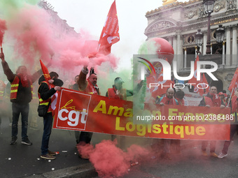 French General Confederation of Labour (CGT) unionists gather in front of Paris' Opera Garnier on December 20, 2017, to protest against Fren...