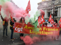 French General Confederation of Labour (CGT) unionists gather in front of Paris' Opera Garnier on December 20, 2017, to protest against Fren...