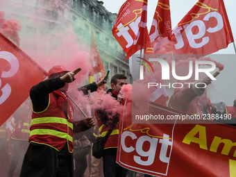 French General Confederation of Labour (CGT) unionists gather in front of Paris' Opera Garnier on December 20, 2017, to protest against Fren...