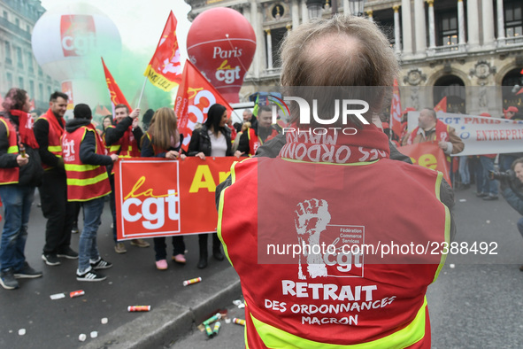 French General Confederation of Labour (CGT) unionists gather in front of Paris' Opera Garnier on December 20, 2017, to protest against Fren...